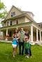 Family in front of new house